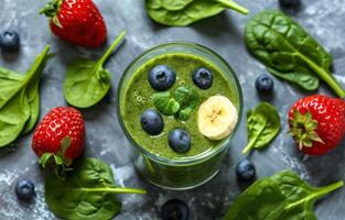 AI generated green smoothie with spinach, bananas, blueberries, and strawberries photo