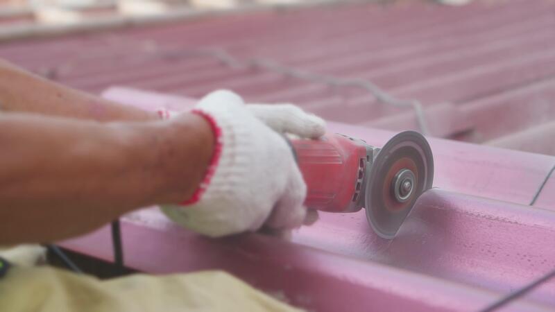 A worker cutting a tile using an angle grinder at construction site 37231057 Stock Video at Vecteezy