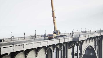 big auto crane on the bridge under constraction video