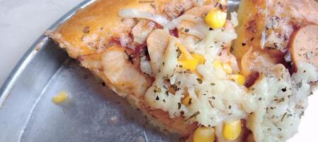 Corn pizza with cheese and sausage photo