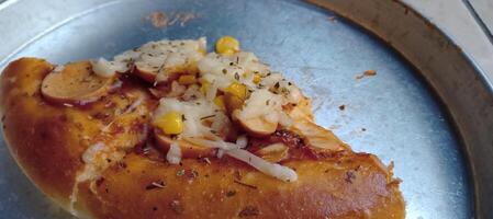 Corn pizza with cheese and sausage photo
