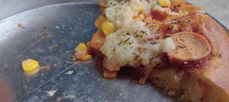 Corn pizza with cheese and sausage photo