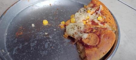 Corn pizza with cheese and sausage photo