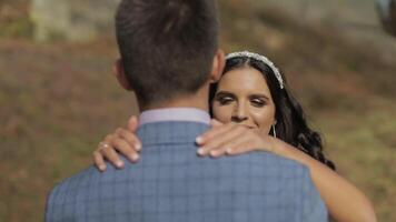 Groom with bride in the park. Wedding couple. Happy family in love video