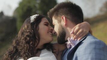 Groom with bride in the park. Wedding couple. Happy family in love video
