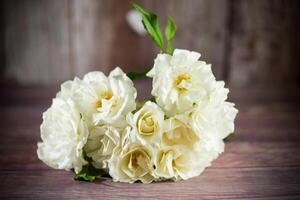 bouquet of beautiful white roses on table photo