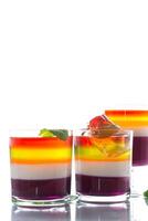 lot of colored sweet fruit jelly in a glass photo