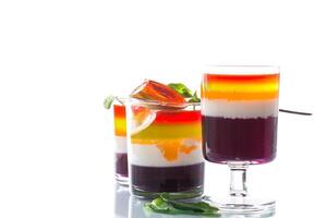 lot of colored sweet fruit jelly in a glass photo