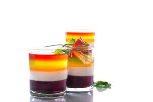 lot of colored sweet fruit jelly in a glass photo