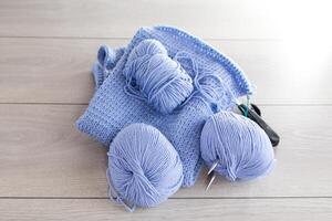 Set for hand knitting, blue yarn, knitting needles. photo