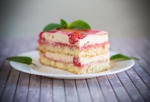 strawberry poppy cake with cream in a plate photo