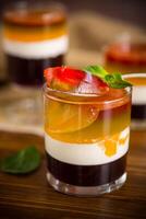 lot of colored sweet fruit jelly in a glass photo