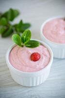 sweet curd mass whipped with fresh strawberries in a bowl photo