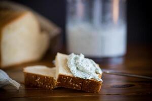 homemade salted curd spread with herbs and garlic photo