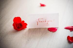 bouquet of beautiful red roses in a basket on table photo