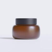 Round packaging of cream. Jar of cream brown color isolated on background color photo