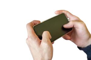 Hands hold playing blank smartphone with touchscreen on background photo