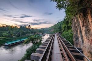 Railroad wood history world war II in tham krasae cave at evening photo