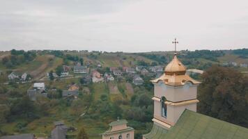 The Church in the old village. View from the top. Panorama. Aerial shot video