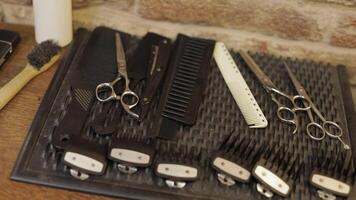 Shaving set with equipment, tools and foam, barber shop, scissors, comb on desk video