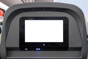 White display entertain screen with button and channel on rear seat in plane photo