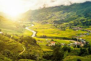 Beautiful sunrise on rice field terraced with tribe village in valley photo