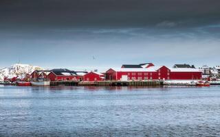 Red warehouse of fishing village industry with on harbor photo