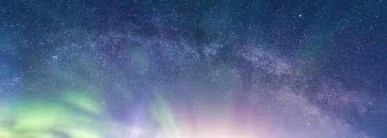 Beautiful Aurora borealis with milky way glowing in the night sky on arctic circle photo