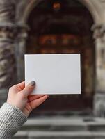 AI generated Empty postcard in a woman's hand in the center of the city. White mock up of a horizontal postcard. High quality. AI Generative photo