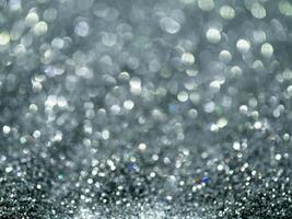 Silver sparkling glitter bokeh background. photo