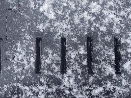 Texture of fallen snow on objects photo