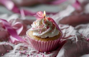 AI generated tiny cupcake with candle and pink ribbon photo