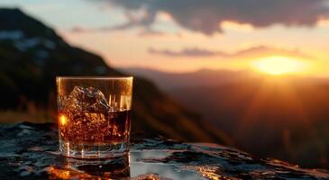 AI generated a glass of whisky sitting on top of a table with a sunset image photo