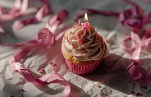 AI generated a pink cupcake with a candle and pink ribbons photo