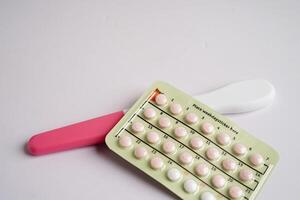 Pregnancy test with birth control pills for female of ovulation day, fetus, maternity, childbirth. photo