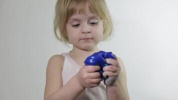 Child having fun making slime. Kid playing with hand made toy slime. video