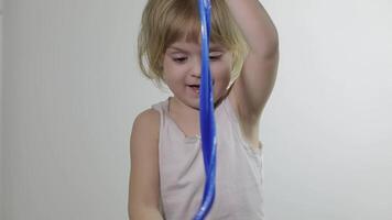 Child having fun making slime. Kid playing with hand made toy slime. video