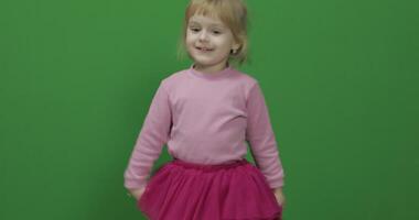 Happy three years old girl. Cute blonde child. Dancing and make faces video