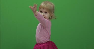 Happy three years old girl. Cute blonde child. Dancing and make faces video