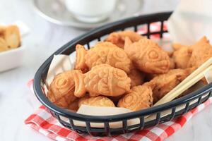 puenting taiyaki, pescado conformado coreano japonés calle comida foto