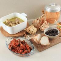 Lebaran Menu with Rendang, Ketupat, Opor, and Sambal Goreng. photo