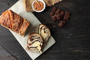 Slice Chocolate Babka or Brioche Bread. Homemade Sweet Yeast Pastry photo