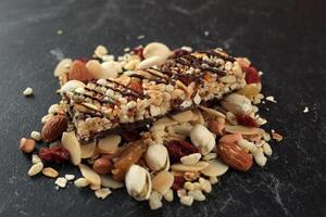 Cereal Healthy Snack. Granola Bar with Nuts and Dry Fruit Berries. photo