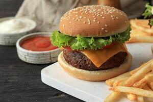 Homemade Beef Burger Served with French Fries photo