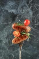 Grilled Sausages with Tomato and Rosemary photo