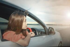 Successful Chinese businesswoman sitting in the car photo