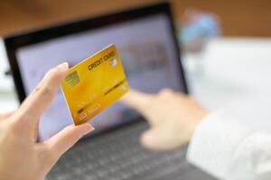 business woman is using credit card to pay for products online when ordering products from store through an online website because using credit card to pay for products brings convenience in shopping photo