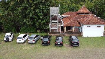Aerial photo of a line of cars in a field in Mindi, Klaten, Central Java, Indonesia.
