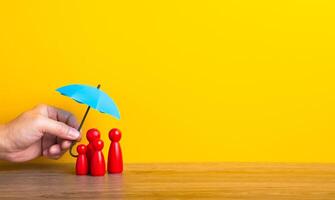 Hand holding umbrella and cover family. photo