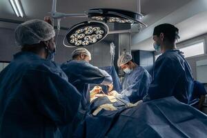 Doctors performing surgery in the hospital photo